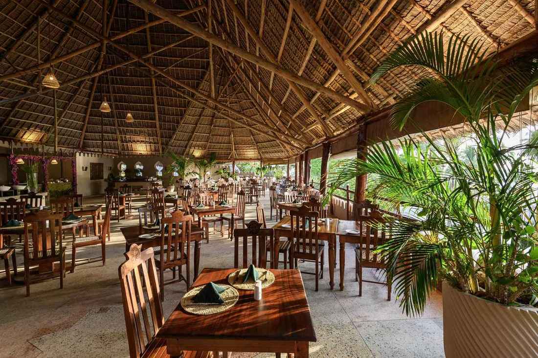 The Palm restaurant under a makuti thatch roof